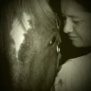 Black and white picture of a woman and horse