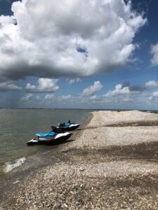 Sea Doo's beached on a rocky shore