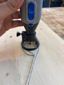 Using a Dremel toll with router attachment to carve wood